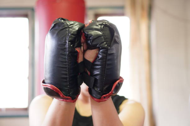 istock Sport: Female boxer warm-up for home workout, exercise at home, close up. 1419224193