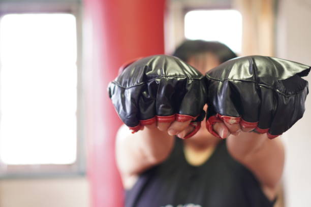 istock Sport: Female boxer warm-up for home workout, exercise at home, close up. 1419224197
