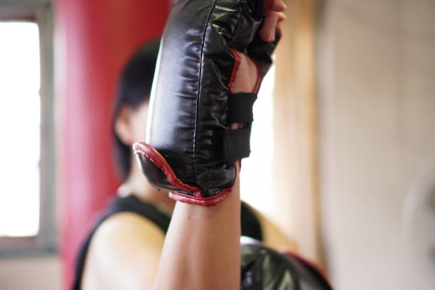 istock Sport: Female boxer warm-up for home workout, exercise at home, close up. 1419224201