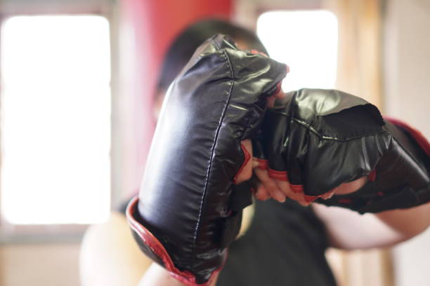 istock Sport: Female boxer warm-up for home workout, exercise at home, close up. 1419224202