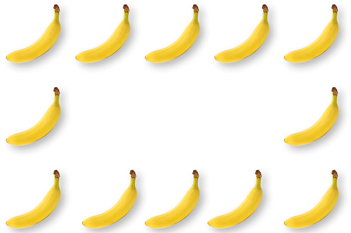 Overhead shot of banana frame on white background.