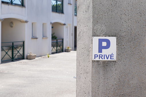 parking p privé french text sign blue means private parking car parked in city street