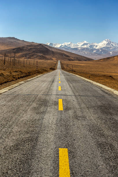 istock Snow mountain and national highway 1419230677