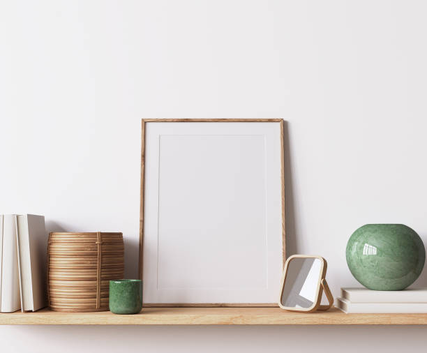 istock Modern poster frame mockup, minimal room design on white interior background, wooden frame mock up 1419233838