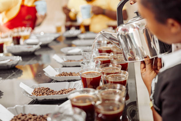 istock Woman pouring water from kettle for coffee tasting 1419245057