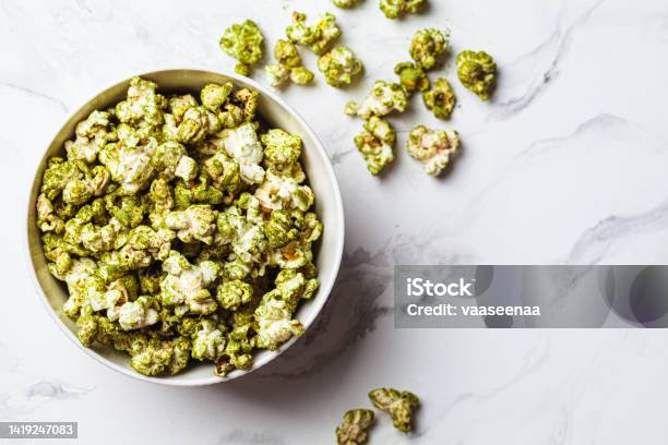 Green Spirulina Popcorn In White Bowl Alternative Food Healthy Dessert Plantbased Diet Stock Photo - Download Image Now
