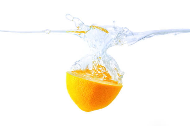 ripe yellow citrus covered with drops of water, wet citrus peel with lots of drops of pure water, close up