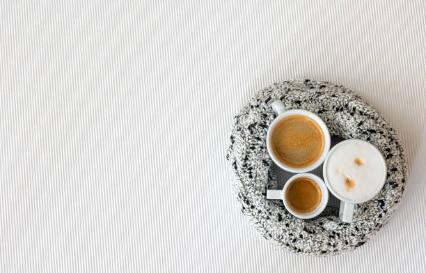 istock Three cups of coffee on a white texture background, flat lay. 1419247740