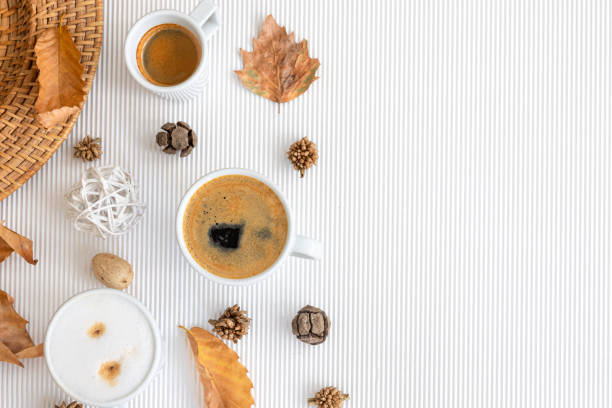istock Autumn composition with cups of coffee and leaves on a white background. 1419247749
