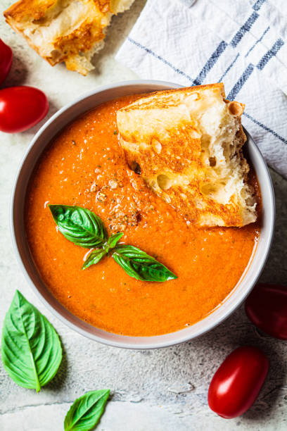 istock Traditional gazpacho in gray bowl. Summer tomato soup with basil. 1419247819