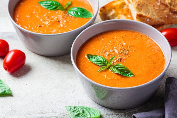 istock Traditional gazpacho in gray bowl. Summer tomato soup with basil. 1419247853