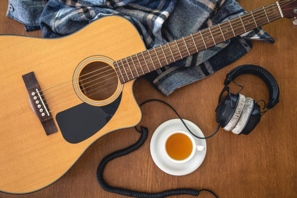 istock Music background with acoustic guitar, top view. 1419248573