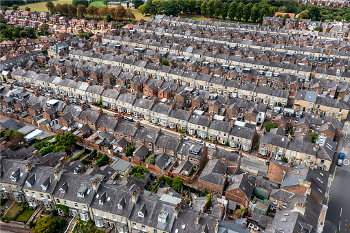 Aerial view of old terraced houses on back to back streets in the suburbs of a large UK city