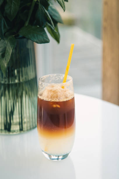 istock Espresso tonic in a glass with a yellow drinking straw. 1419249973