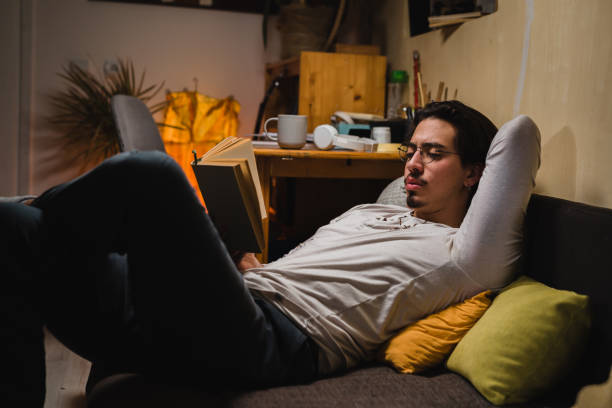 istock young adult man relaxing in his room 1419250061
