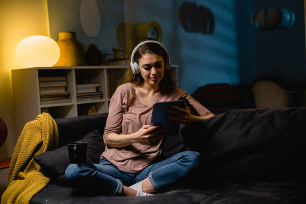 istock young woman relaxing at home using digital tablet 1419250234