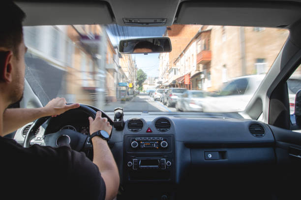 istock Hands on the wheel when driving at high speed from inside the car. 1419252202