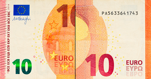 One ten Euro bill. 10 euro banknote close-up. The euro is the official currency of 19 out of the 27 member states of the European Union