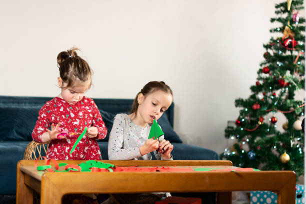 istock Children making DIY Christmas decoration at home 1419254708