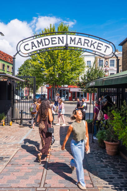 London shoppers at entrance to Camden Market summer day stock photo