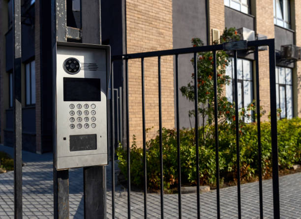 istock Electronic lock intercom with buttons on the metal fence gate, safety device. 1419258602