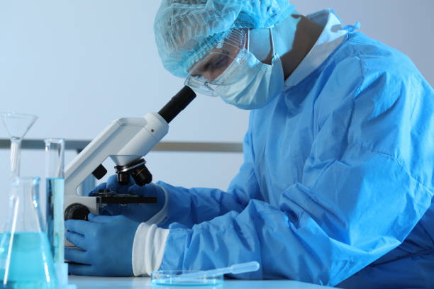 istock Scientist working with microscope in laboratory. Medical research 1419266241