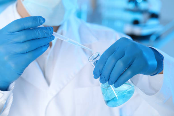 istock Scientist dripping sample into flask in laboratory, closeup. Medical research 1419268056