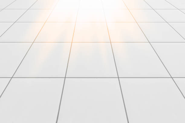 istock tile floor texture inside the office building.
 white shot from the side. See the light through the door in the morning. 1419271358
