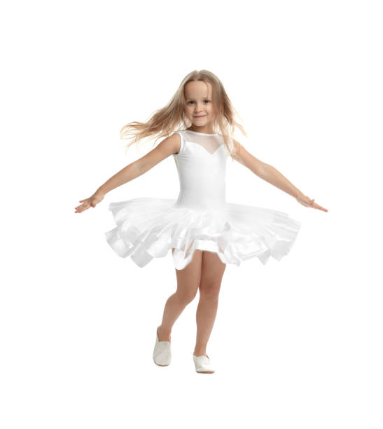 cute little girl in beautiful dress dancing on white background - gymnastics smiling little girls only isolated on white imagens e fotografias de stock