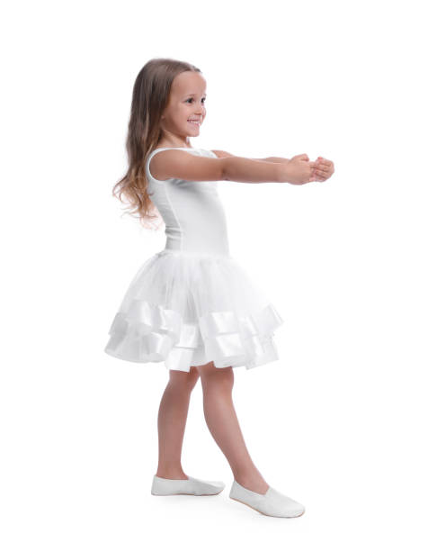 cute little girl in beautiful dress dancing on white background - gymnastics smiling little girls only isolated on white imagens e fotografias de stock