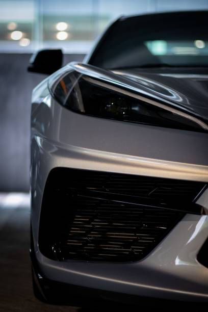 istock Vertical closeup of a white modern car headlights 1419275059