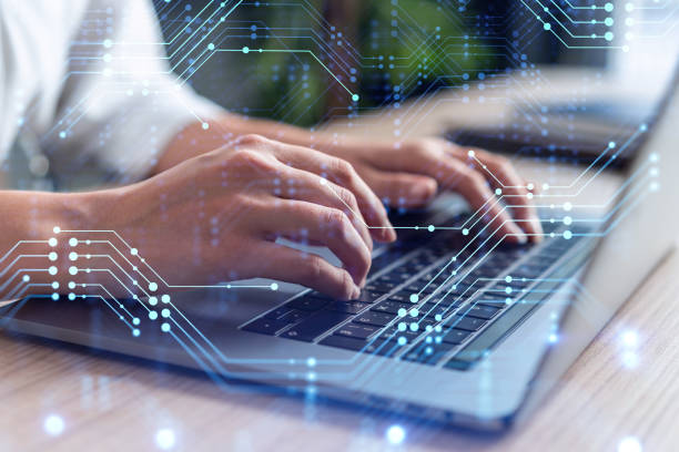 istock Woman typing the keyboard to create innovative software to change the world and provide a completely new service. Close up shot. Hologram tech graphs. Concept of Dev team. Formal wear. 1419275400