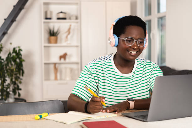 istock Happy African American female freelancer working at home office 1419277548