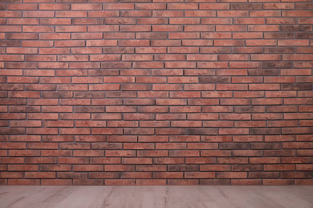 istock Empty room with brick wall and wooden floor 1419278758