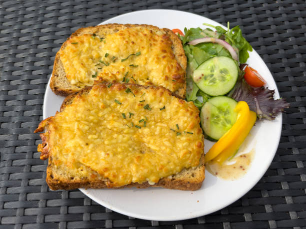 Welsh rarebit - cheese on toast Two slices of Welsh rarebit or cheese on toast welsh culture stock pictures, royalty-free photos & images