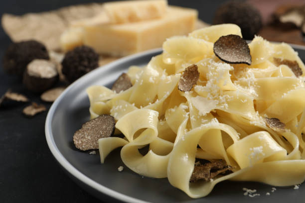istock Tasty tagliatelle with truffle on table, closeup 1419281061