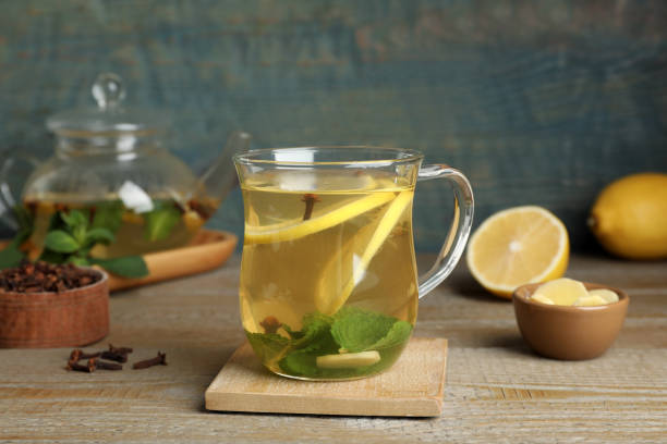 istock Glass cup of immunity boosting drink on wooden table 1419281195