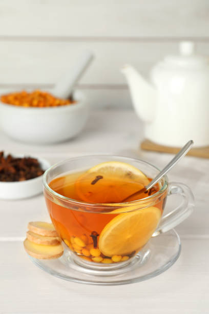istock Glass cup of immunity boosting drink on white wooden table 1419281228