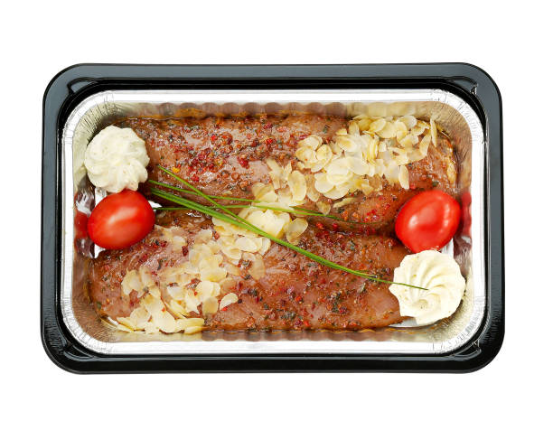 istock Turkey tenderloin filet with spices in plastic tray 1419281288