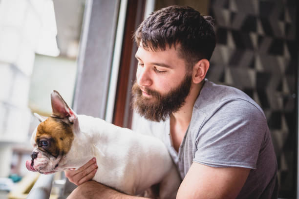 istock Waking up with his dog, looking through the window 1419281378