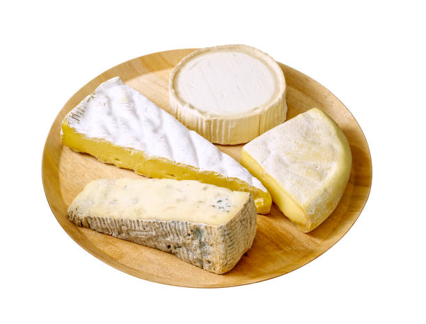 Creamy Brie on rustic wooden background, top view