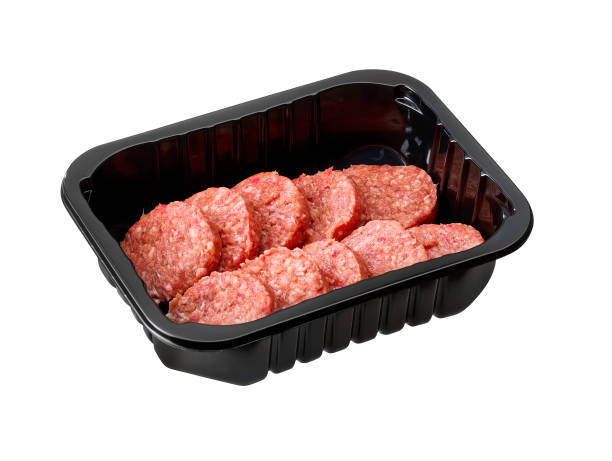 istock raw mini hamburgers in plastic tay isolated 1419281931