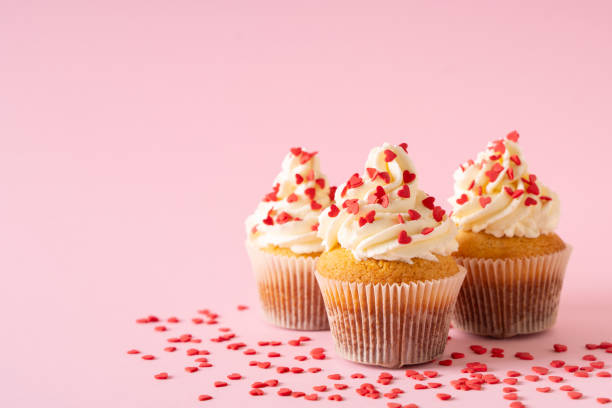 istock Vanilla cupcakes close up on with confectionery sprinkles 1419282438