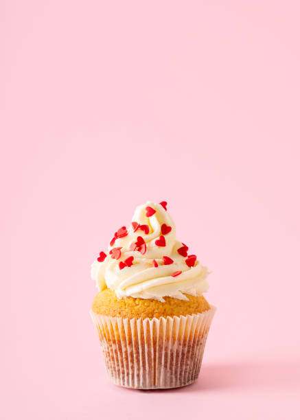 istock Vanilla cupcakes close up on with confectionery sprinkles 1419282768