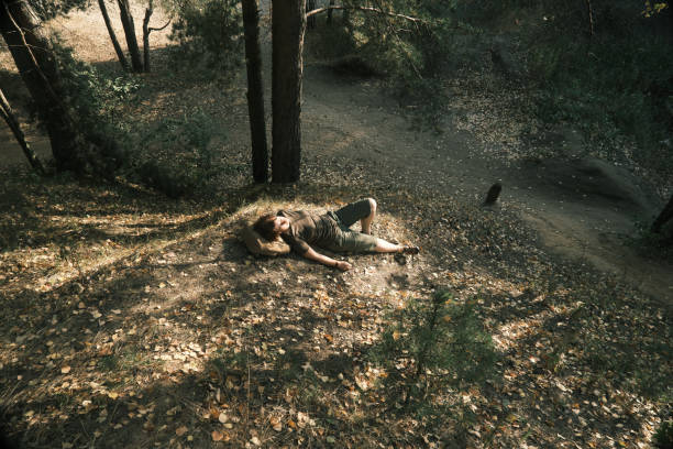 istock Active mature woman is sleeping in forest 1419283753