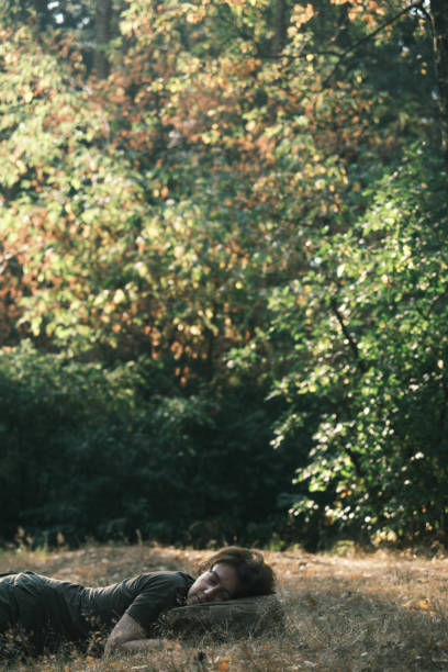 istock Active mature woman is sleeping in forest 1419285072
