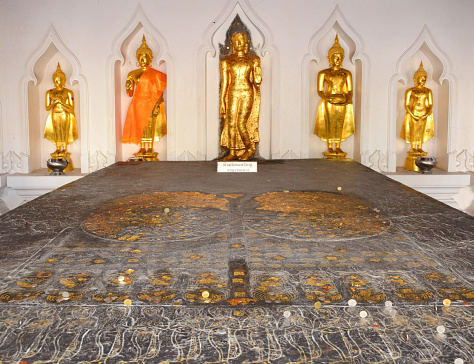 Bangkok, Thailand: Buddha's footprint (Buddhapada) at Wat Bowonniwet Vihara, Thammayut Nikaya order of Thai Theravada Buddhism - the double footprint is carved into one large block of stone.
