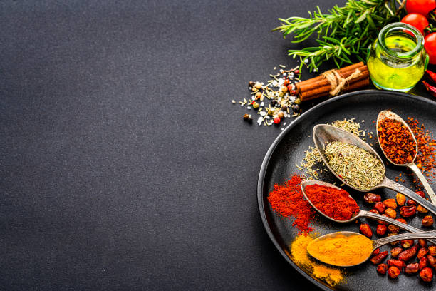 istock Culinary background of scented herbs and spices. Copy space 1419288442