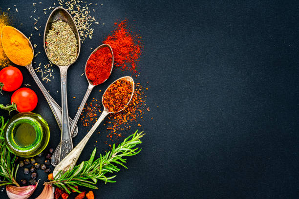 istock Indian spices, condiments and herbs on black background. Copy space 1419288464