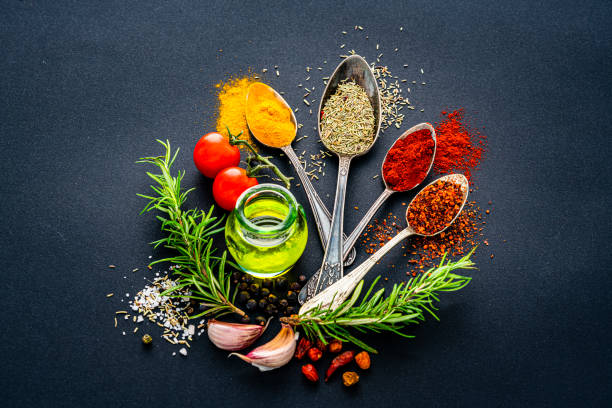 istock Scented Indian herbs and spices on black background. 1419288532